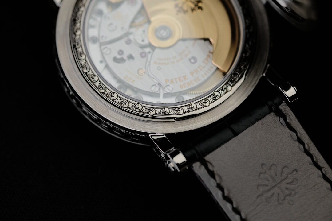 Macro photograph of a Swiss watch movement with visible gears and tourbillon